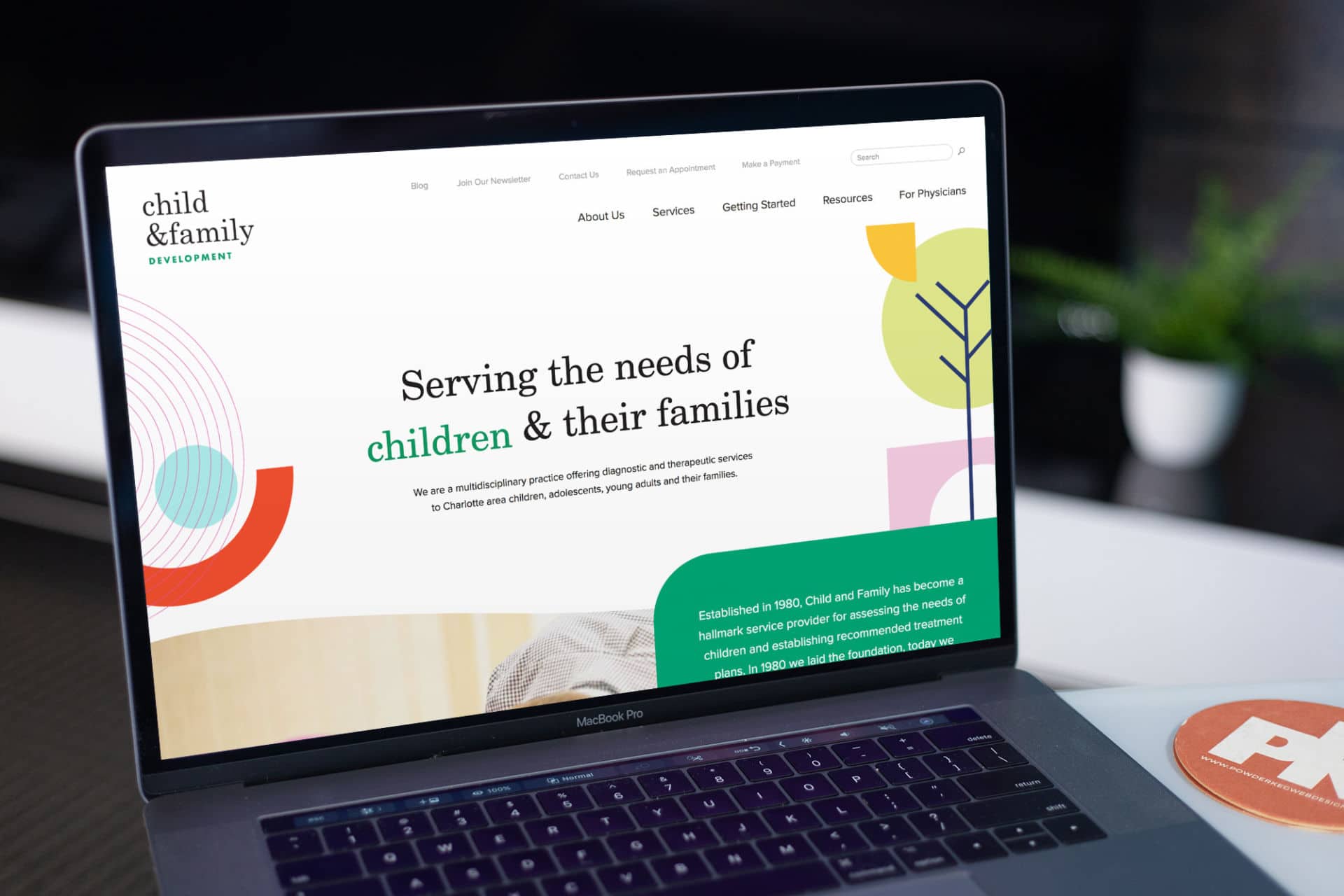 Image of the Child & Family Development website on a laptop.